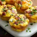 Fluffy breakfast egg muffins cooling on tray