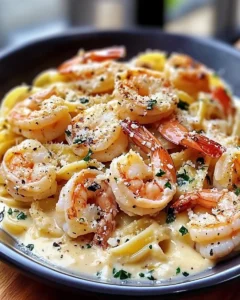 Creamy Parmesan Garlic Shrimp Pasta served in black plate